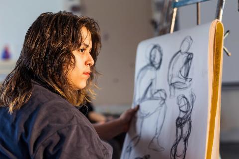 A student doing figure drawing