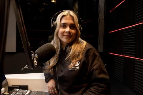 Student in podcast studio